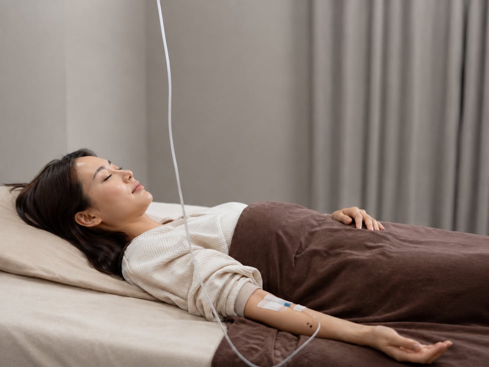 Patient resting during doctor-led IV therapy